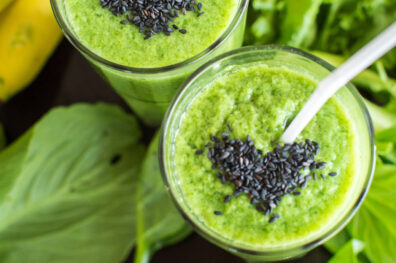 fresh-green-smoothie-with-banana-spinach-with-heart-sesame-seeds-love-healthy-raw-food-concept