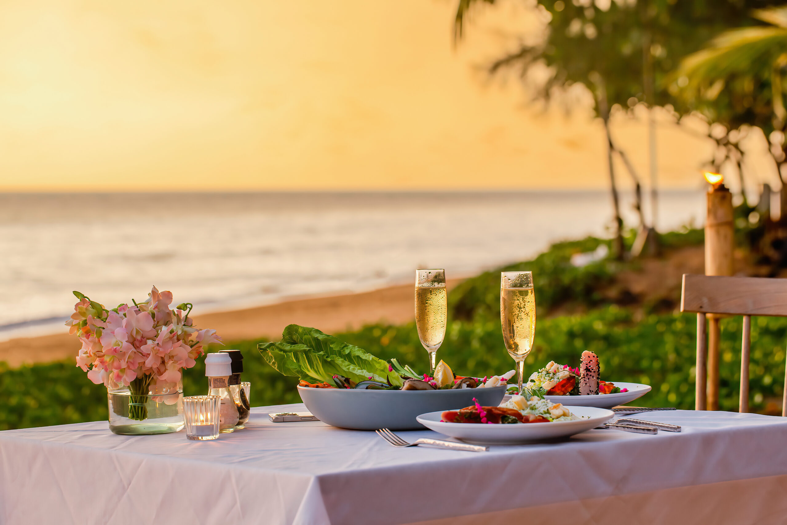 Romantic dinner by the beach at Movenpick Resort Cam Ranh's private shore.