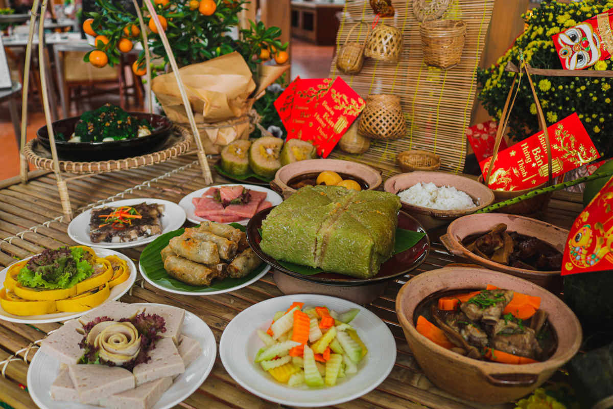 A traditional feast during every Tet Holiday In Vietname includes sticky rice cakes and more.